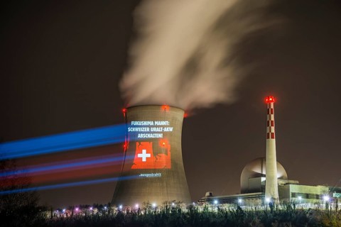 Protest action broadcast by the anti-nuclear organization, projection, night view, 05-03-2026,