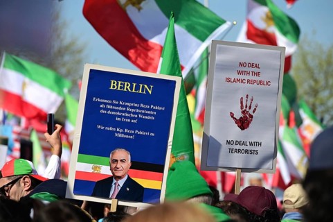 Supporters of Reza Pahlavi demonstrate in front of the Reichstag, including with numerous different