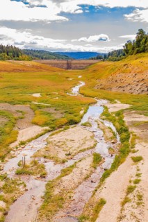 A long, meandering river goes through a wide, green valley, rehabilitation of the Schwarzenbach