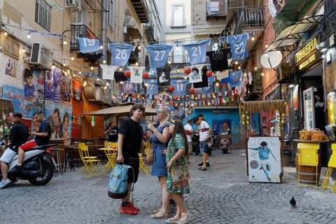 Street scene at Spaccanapoli, pizzeria with soccer decoration, historic old town, Naples, Campania,
