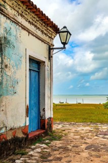 A colonial house deteriorated by time, facing the sea in the historic city of Alcantara in