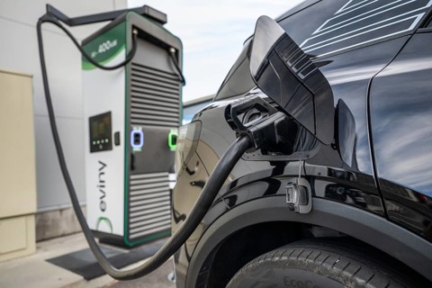 Fully electric Ford Explorer charging cable in electric tank Eviny electric vehicle charging