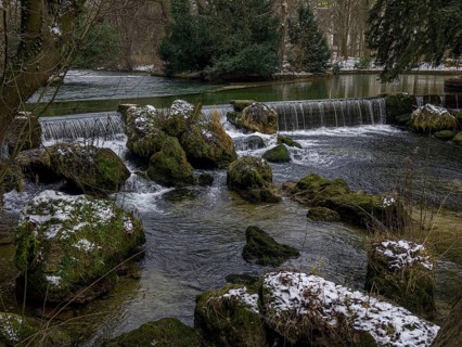 Small waterfall, winter in the English Garden, Munich, Bavaria, Germany
