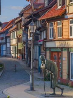 Sculpture The Rast Kochstraße with historic half-timbered houses Wernigerode Harz Germany