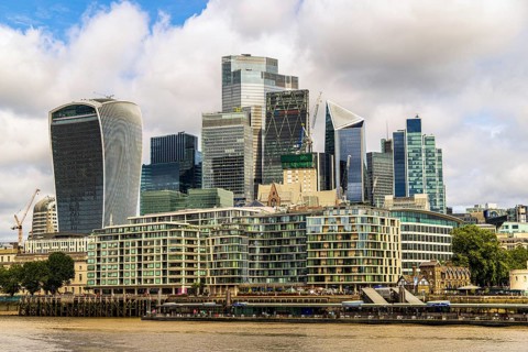 A dense cluster of modern towers, including the Scalpel and 22 Bishopsgate, with the pale stone