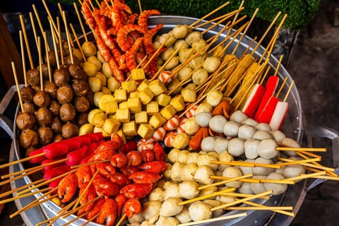 BBQ skewers with Thai specialties at a stand below the Wat Phra That Doi Suthep temple complex,