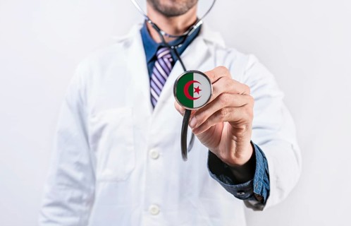 Algeria healthcare system, doctor holding stethoscope. Algeria health and medical insurance concept