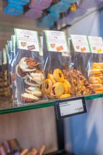 Different pastries in plastic packaging on a glass shelf, Café Kuh, Deckenpfronn, Germany