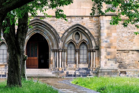 Gothic revival arched stone doorway of Govan Old Parish Church, home to the early medieval Govan