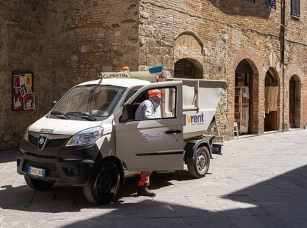 City cleaning employee with his vehicle, Pienza, Tuscany, Italy