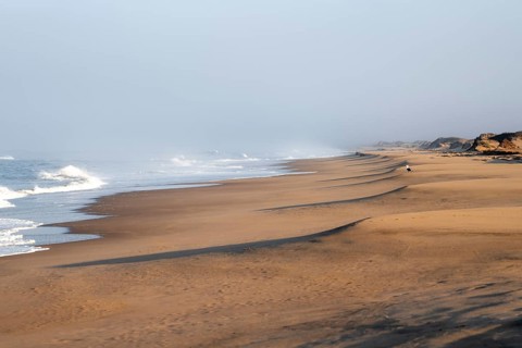 Waves burn on the Atlantic coast, sandy beach in the Namib Desert, desert landscape, Namib Naukluft