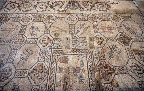 Detailed floor mosaic with geometric patterns and representations of people and animals, Basilica