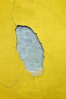 The paint on the façade of a house comes off due to moisture, Austria