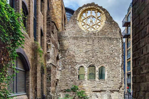 The surviving rose window and stone wall of Winchester Palace, once the London residence of the