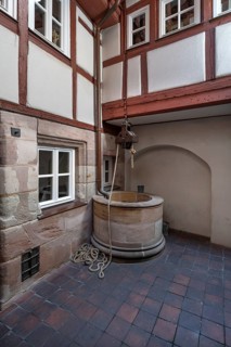 Old fountain in a historic courtyard, Obere Krämergasse 16, Nuremberg, Middle Franconia, Bavaria,
