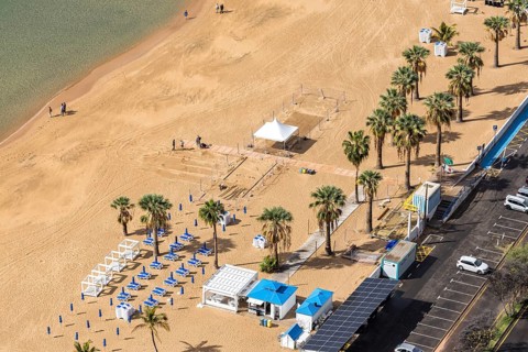 Tenerife beach Playa de las Teresitas seaside holiday with palm trees trip in San Andres, Spain