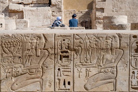 Close up details of ancient Egyptian history shown in reliefs and hieroglyphs inside Medinat Habu,