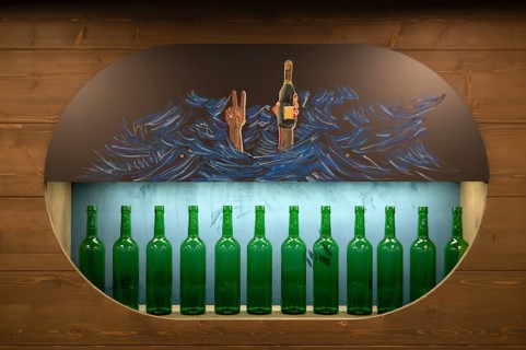 Decoration, various green wine bottles arranged in a row, wine arbor, wine village, gastronomy,