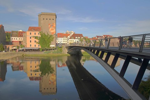 Old town bridge over Lusatian Neisse in Görlitz and Dreiradenmühle with mural WAZE by Polish artist