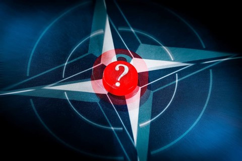 NATO flag with question mark, photo montage +++ editorial use only