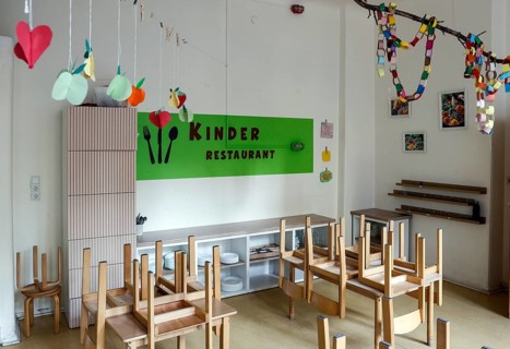 High-standing wooden chairs in the children's restaurant of a daycare center, Berlin, 11.08.2026,