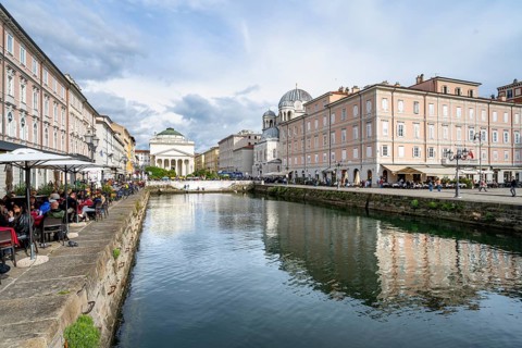 Restaurants on the Grand Canal with reflection, Sant'Antonio Taumaturgo Church in the back, Borgo