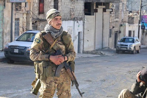 In Aleppo, Syria on January 10, 2026, Syrian Army soldiers deploy throughout the Sheikh Maqsoud and