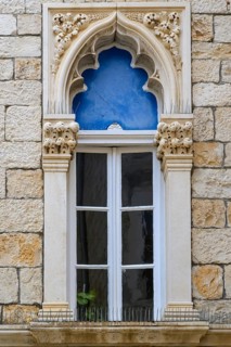 An arched window above a door in the Cipiko Place, Trogir. The Venetian Gothic style was prevalent