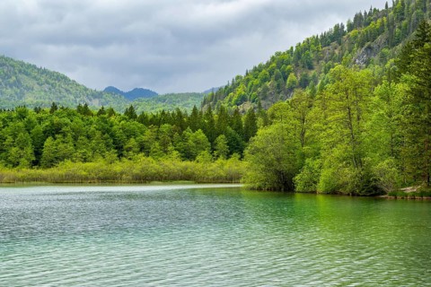 Landscape of Lake Offensee after rain when the sun comes through the clouds in spring,