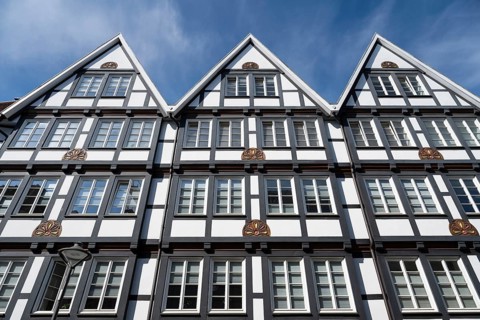 Several historic gabled houses side by side, half-timbered houses, pedestrian zone, Brüderstraße,
