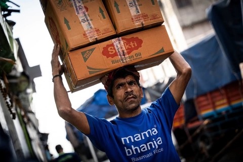 GUWAHATI, INDIA - MAY 1: Labourers carries goods in a wholesale market, in Guwahati, India, on May