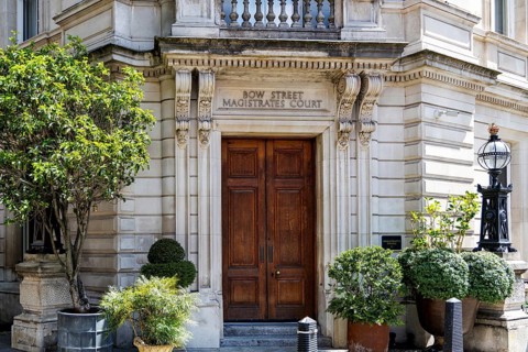 The grand stone facade of the former Bow Street Magistrates' Court reflects a judicial history