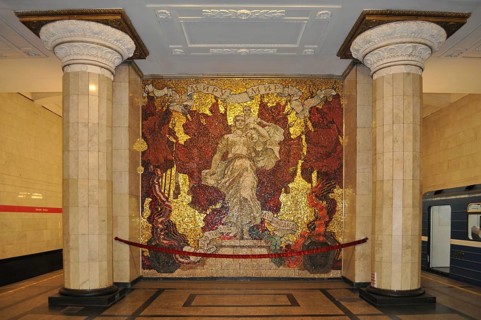 Artistic mosaic between columns in a subway station with dim lighting, metro, Saint Petersburg, St.