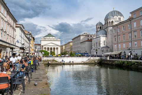 Restaurants on the Grand Canal with reflection, Sant'Antonio Taumaturgo church and Serbian Orthodox