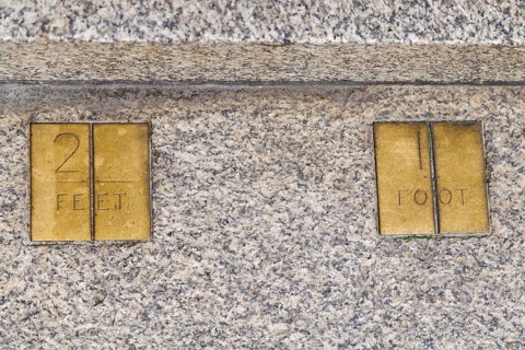 Brass plaques marked 2 feet and 1 foot form part of the Imperial Standards of Length set into the