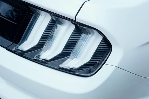 Detailed view, three-part, distinctive rear light of a Ford Mustang, model generation S550 built