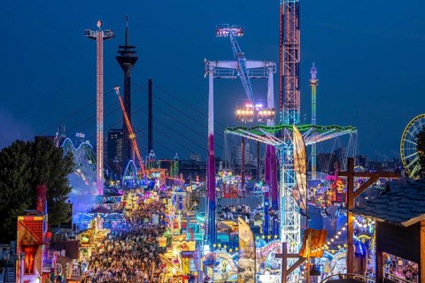 Rhine fair in the Rheinwiesen in Düsseldorf-Oberkassel, view towards the Rhine Tower,