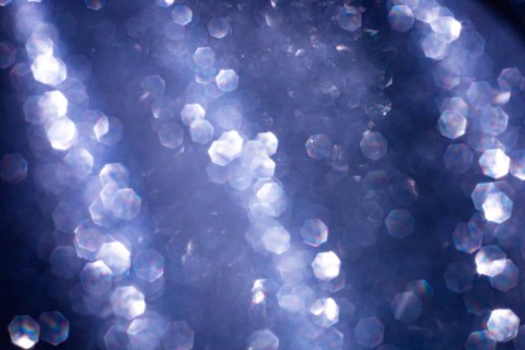 Abstract glitter lights textured blue and white background, de-focused, bokeh. Christmas or New