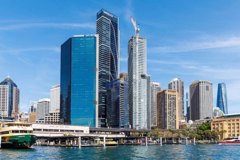 Tall skyscrapers of the CBD rise above the Circular Quay Ferry Terminal, Sydney, Australia
