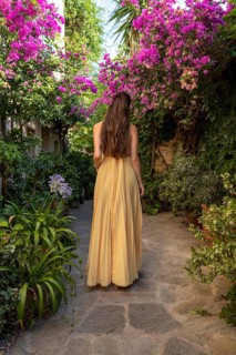 A model photographed in Rue des Amoureux in the village of Ramatuelle, Ramatuelle, Var,