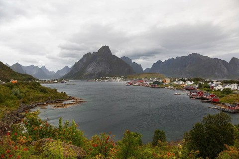 Wide panoramic view of Reinefjorden bay with the fishing village of Reine and the distinctive
