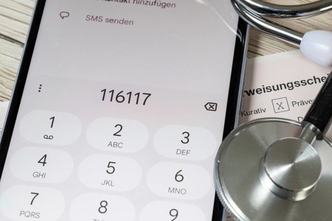 Representative image: Close-up of a referral form for a specialist and a smartphone displaying the