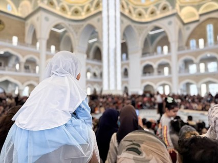 Dozens of Muslim children participate in indoor entertainment event inside a grand mosque during