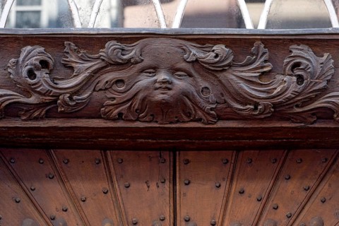 Hotel Nassau Oranien, historic half-timbered house, baroque, mask, cherub on the lintel above the