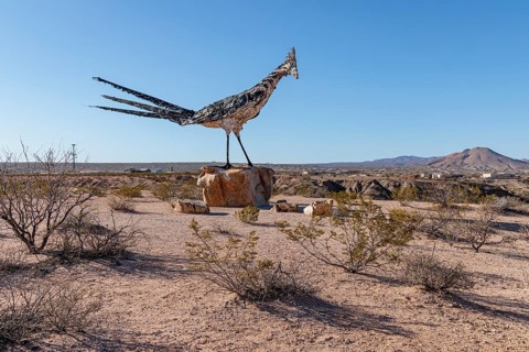 Giant Recycled Roadrunner statue made entirely from discarded materials by artist Olin Calk at an