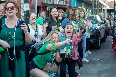 New Orleans, Louisiana - Spectators line the sidewalks as the Downtown Irish Club holds its St