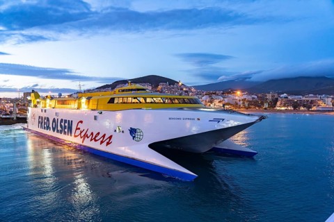 Fred Olsen ferry in the harbour of Los Cristianos at dusk, Tenerife, Canary Islands, Spain
