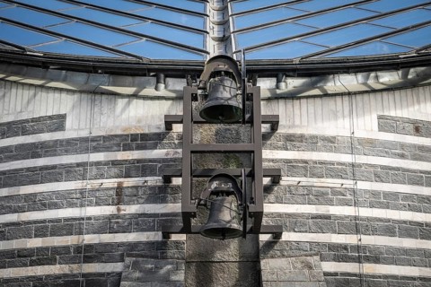 Bells of the village church destroyed by avalanche in 1986, new San Giovanni Battista church in the