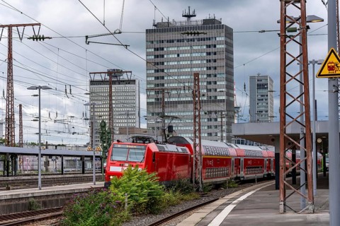 Regional Express, RE2, in Essen main station, city skyline, high-rise office buildings, North