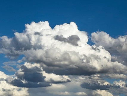 Large field of large cumulus cluster clouds under blue sky, international